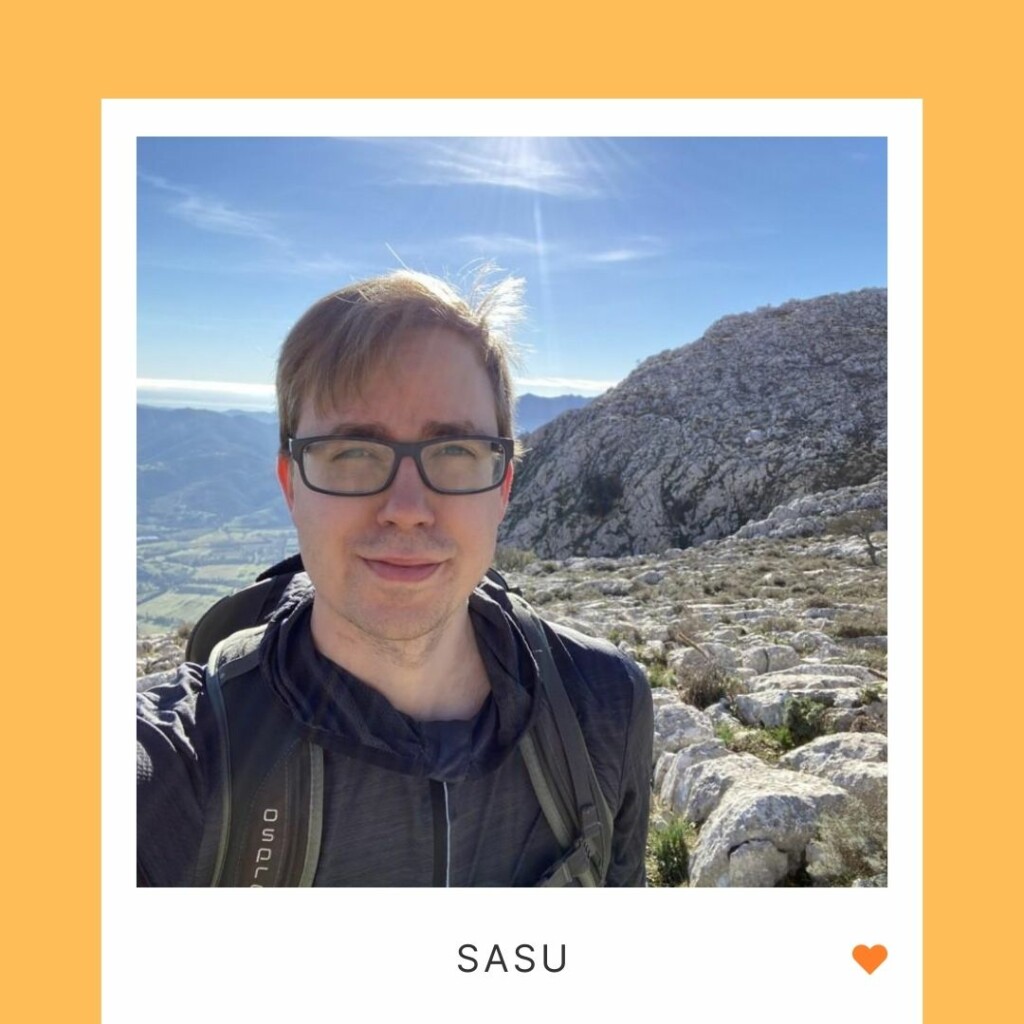 A smiling person in a closeup photo, in the background mountains, under the photo the text "Sasu" and an orange heart.