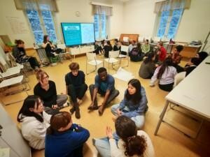 People sitting in circles in a room.
